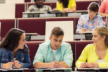 Image showing group of students with notebooks in lecture hall