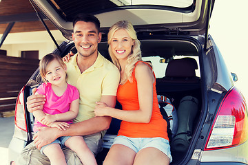 Image showing happy family with hatchback car at home parking