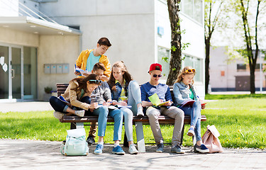 Image showing group of students with notebooks at school yard