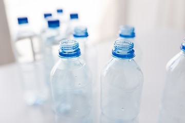 Image showing close up of bottles with drinking water on table