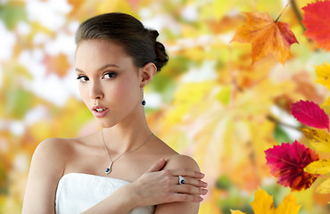 Image showing beautiful woman with earring, ring and pendant