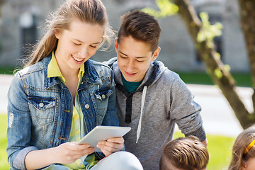 Image showing group of students with tablet pc at school yard