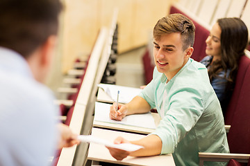 Image showing teacher giving test to student boy on lecture