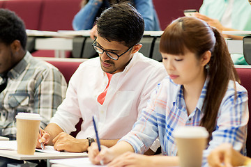 Image showing group of students with coffee writing on lecture