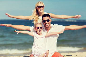 Image showing happy family having fun on summer beach