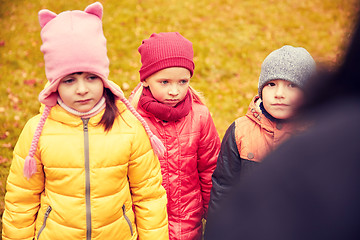 Image showing sad kids being blamed for misbehavior outdoors