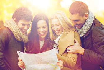 Image showing couples with tourist map in autumn park