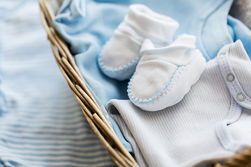 Image showing close up of baby clothes for newborn boy in basket