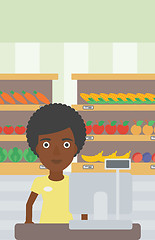 Image showing Cashier standing at the checkout in supermarket.