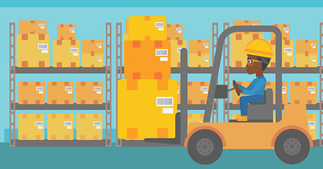 Image showing Warehouse worker moving load by forklift truck.