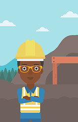 Image showing Miner with mining equipment on background.