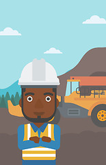 Image showing Miner with mining equipment on background.