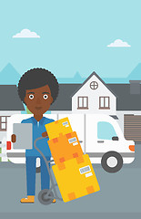 Image showing Delivery woman with cardboard boxes.