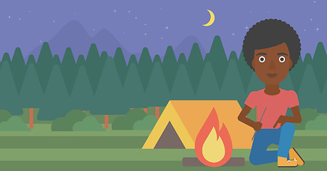 Image showing Woman kindling campfire vector illustration.