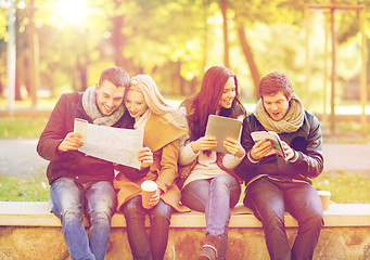 Image showing couples with tourist map in autumn park