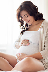 Image showing close up of happy pregnant woman at home
