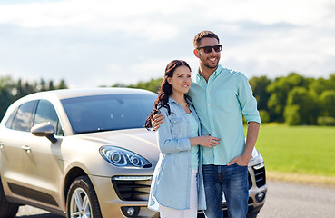 Image showing happy man and woman hugging at car