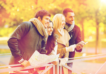 Image showing couples with tourist map in autumn park