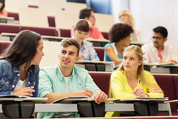 Image showing group of students with notebooks in lecture hall