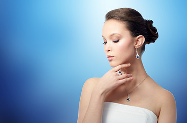 Image showing beautiful woman with earring, ring and pendant