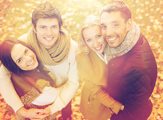 Image showing group of friends having fun in autumn park