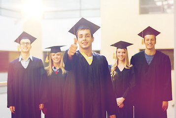 Image showing group of smiling students in mortarboards