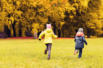 Image showing group of happy little kids running outdoors