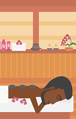 Image showing Man getting stone therapy vector illustration.