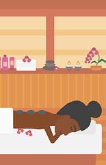 Image showing Woman getting stone therapy vector illustration.