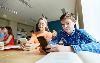 Image showing students with smartphone texting at school