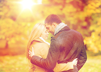 Image showing romantic couple kissing in the autumn park