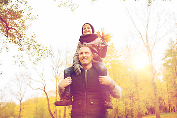 Image showing happy family having fun in autumn park