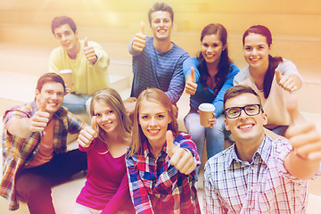 Image showing group of smiling students with paper coffee cups