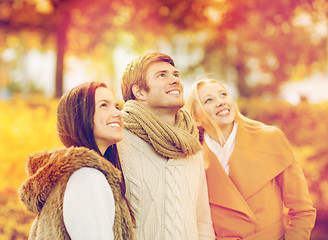 Image showing group of friends having fun in autumn park