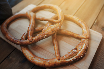 Image showing close up of two pretzels on wooden table