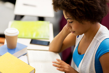 Image showing student girl with books and coffee on lecture