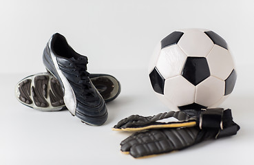 Image showing close up of goalkeeper gloves, ball, soccer boots