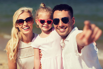 Image showing happy family in sunglasses on summer beach