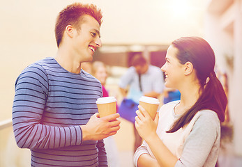 Image showing group of smiling students with paper coffee cups