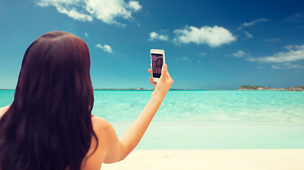 Image showing young woman taking selfie with smartphone