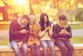 Image showing group of friends having fun in autumn park