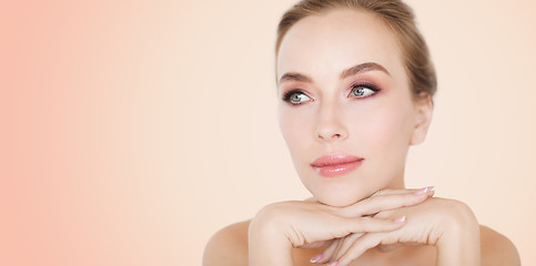 Image showing beautiful young woman face and hands