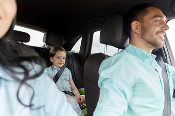 Image showing happy family with little child driving in car