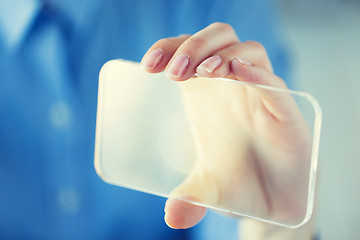 Image showing close up of woman with transparent smartphone