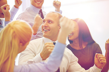 Image showing smiling business people meeting in office