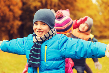 Image showing group of happy children having fun in autumn park