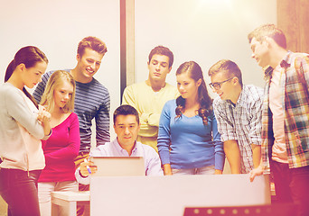 Image showing group of students and teacher with laptop