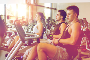 Image showing men working out on exercise bike in gym