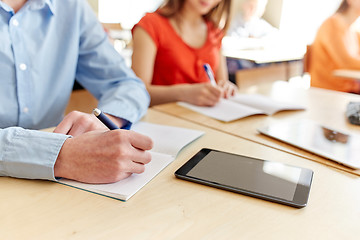 Image showing close up of students tablet pc writing at school