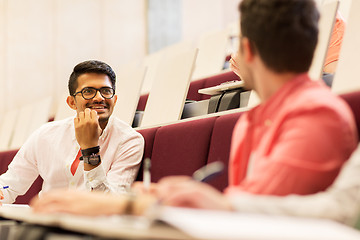 Image showing group of students with notebooks in lecture hall